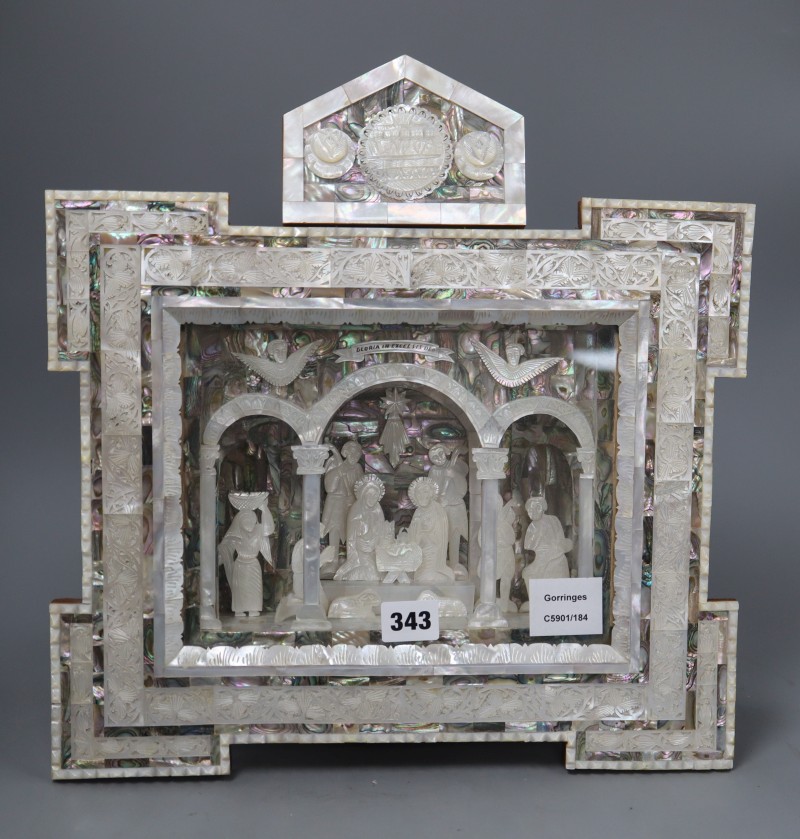 A mother of pearl, abalone and olivewood relief plaque, length 37cm